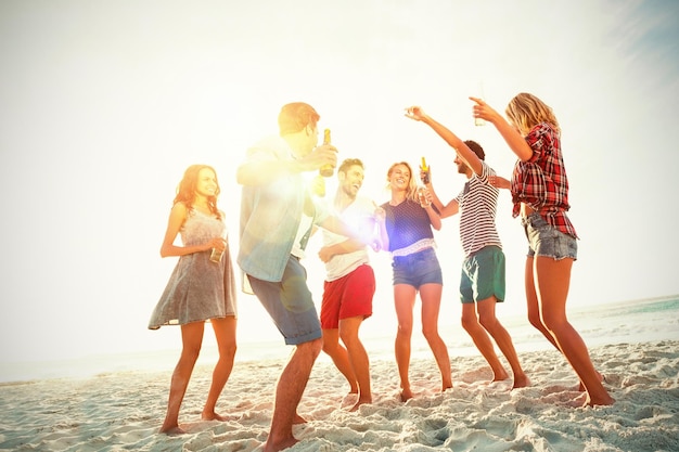 Friends dancing at beach