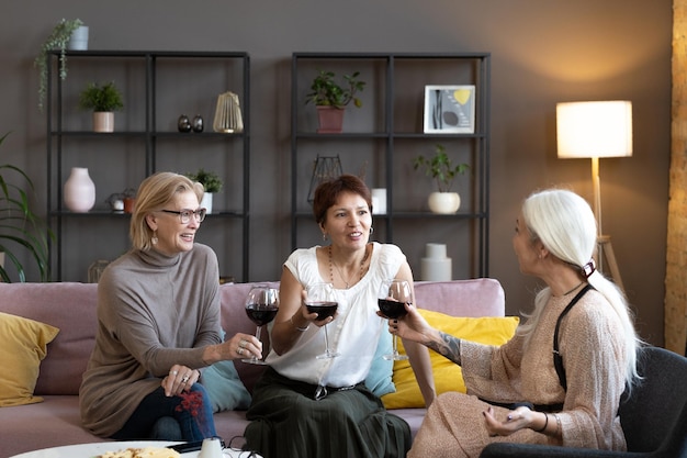 Friends drinking wine at a meeting