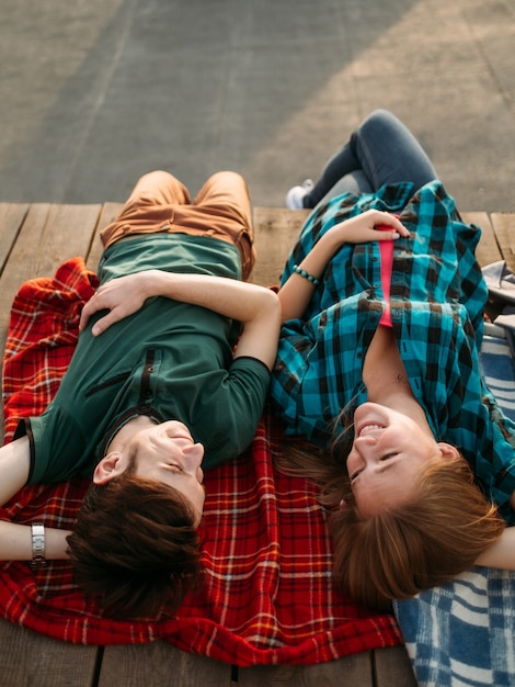 Friends hanging out together. Leisure, pastime, fun activity. Carefree teens relaxing