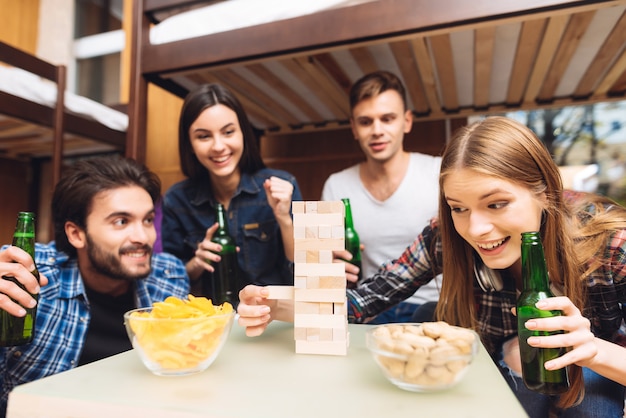 Friends happy and smile playing in jenga.