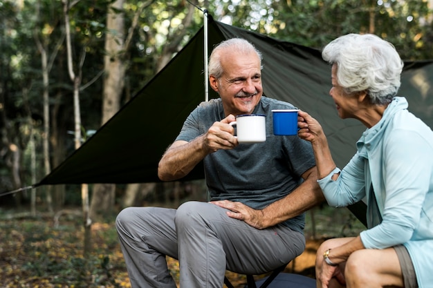 Friends having coffee at a campsite