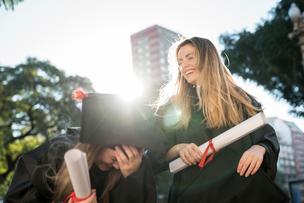 Friends having fun at their graduation 