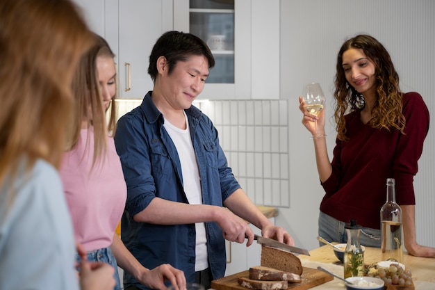 Friends having fun together while cooking