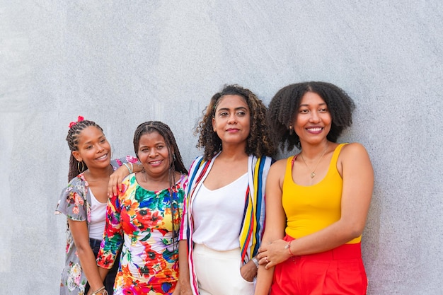 Friends share a joyful moment against a gray backdrop