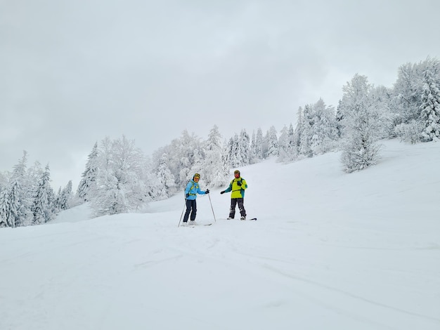 Friends skier and snowboarder powder day ukraine carpathian mountains