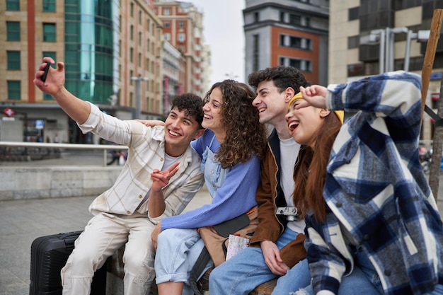 Friends taking selfie on a bench in Spain