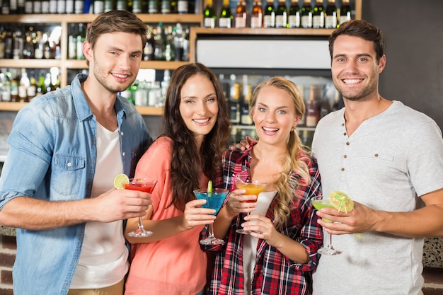 Friends toasting with cocktails