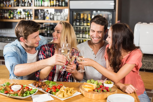 Friends toasting with white wine