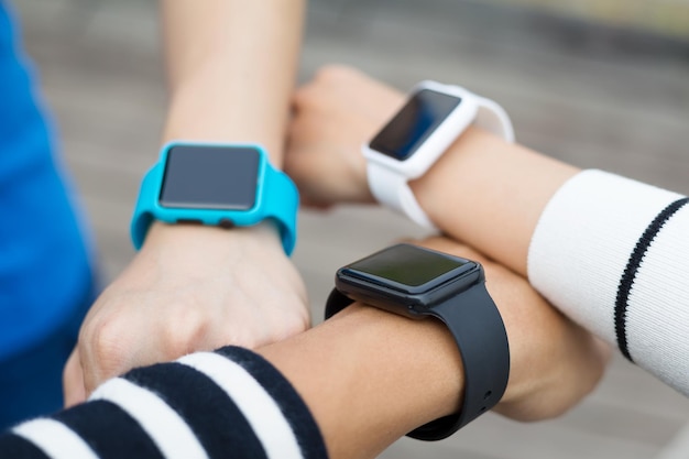 Friends using smart watch together