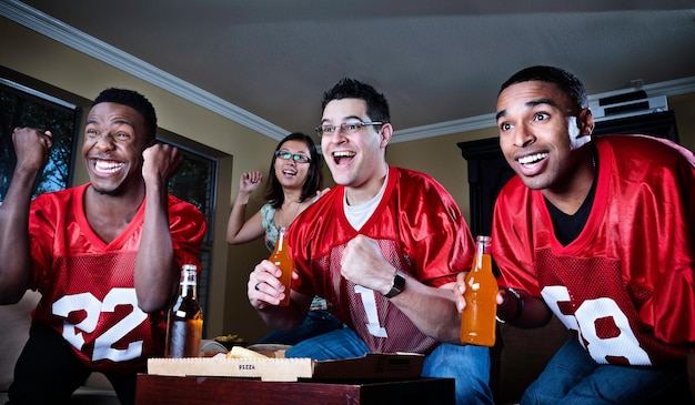 friends watching football on TV