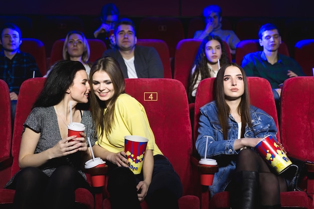 Friends watching movies in a movie theater