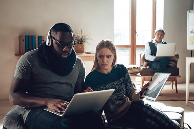 Friends at Workplace Frowning Girl Dislikes Idea.