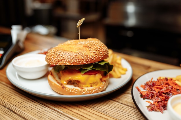 Fries and sancwich combo on the plate.