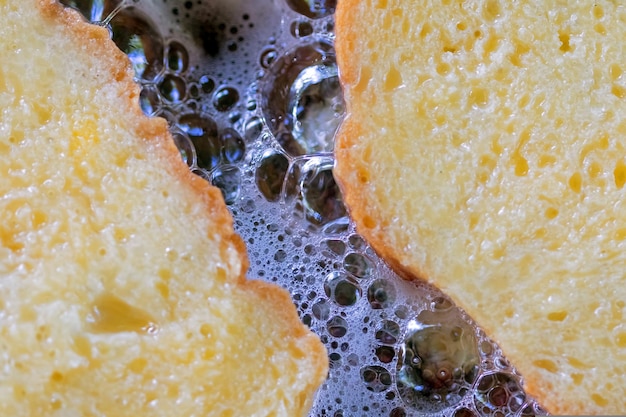 Fritters are fried on a metal pan