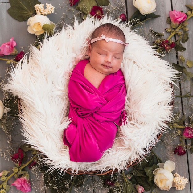 From above view of tiny baby sleeping