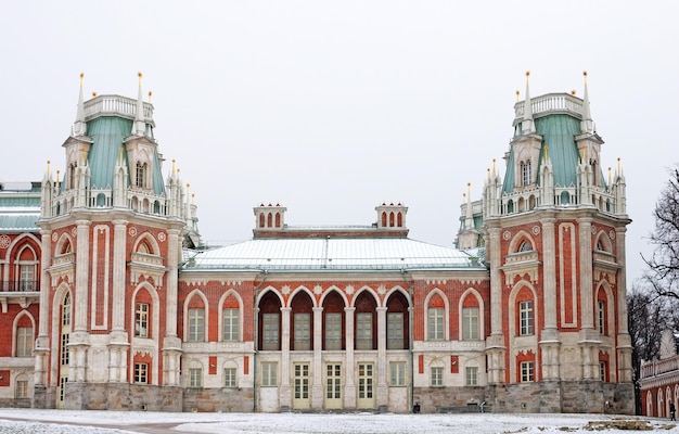 The front of the building is covered in snow.