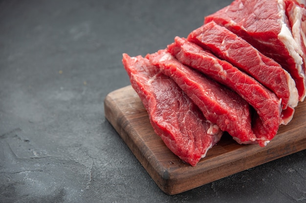 front close view fresh sliced meat raw meat on dark surface