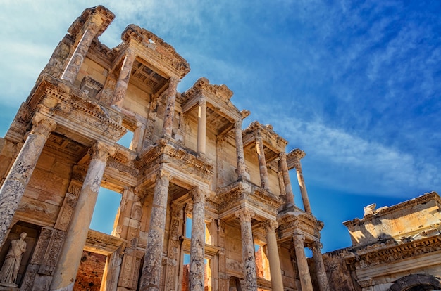 The front facade and courtyard of the Library of Celsus at Ephesus is an ancient Greek and Roman structure. Reconstructed by archaeologists from old stones, it is near the city of Izmir in Turkey.