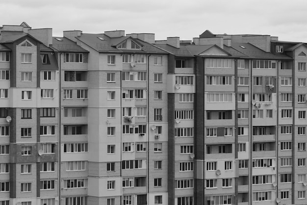 The front of the residential building is black and white