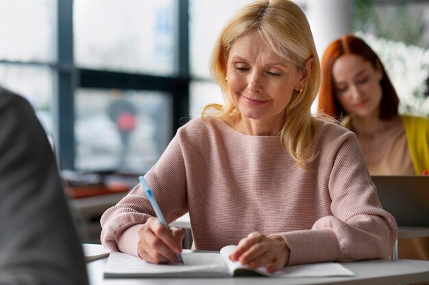 Front view adults studying together