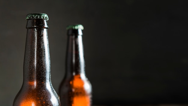 Front view of beer glass bottles with copy space