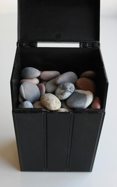 Front View Of Black Box With Decorative Stones For Decoration And Landscaping