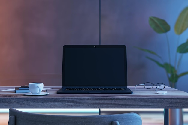 Front view on blank black modern laptop screen with space for web design or web site on wooden work table with coffee mug and eyeglasses on dark wall background 3D rendering mock up