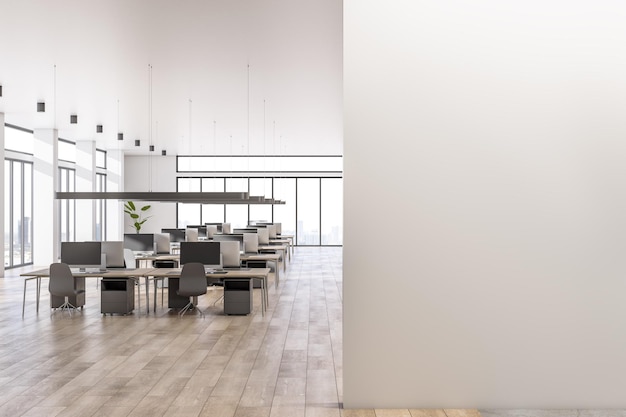 Front view on blank light wall with place for your logo in spacious sunlit office area with cozy workspaces high ceiling panoramic windows with city view and wooden floor 3D rendering mock up