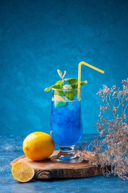 Front view blue cool lemonade with ice on blue background fruit water cold cocktail drinks color bar juice