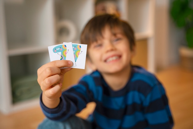 Front view boy playing memory game