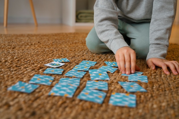 Front view boy playing memory game