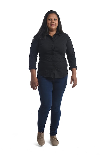 Front view of a brunette woman walking on white background