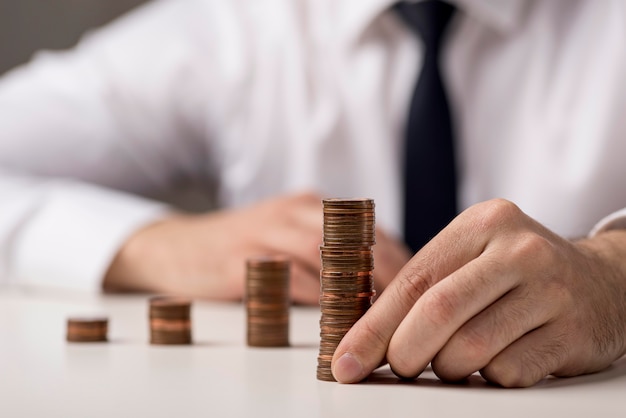 Front view of coins held by businessman