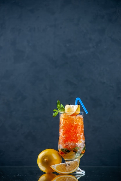 front view cool orange cocktail with lemon and ice on light blue background cold drink color lemonade ice bar juice