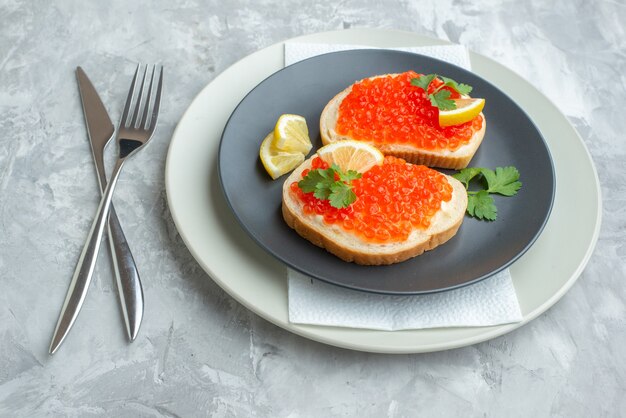 front view delicious caviar sandwiches inside plate on white surface snack bread dish breakfast dinner fish food toast meal