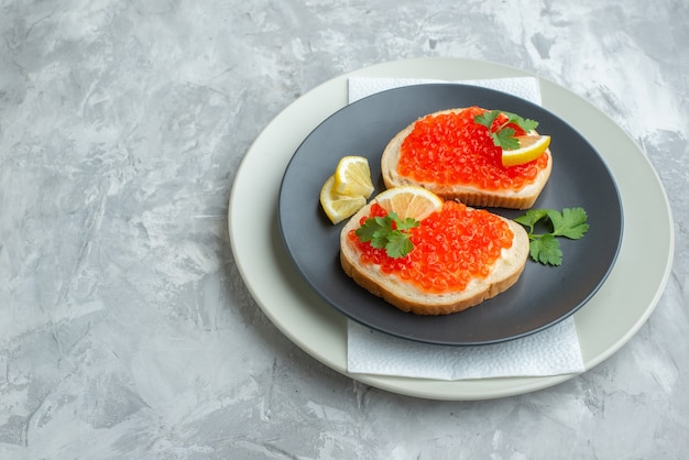 front view delicious caviar sandwiches inside plate on white surface snack bread dish breakfast meal dinner fish food toast