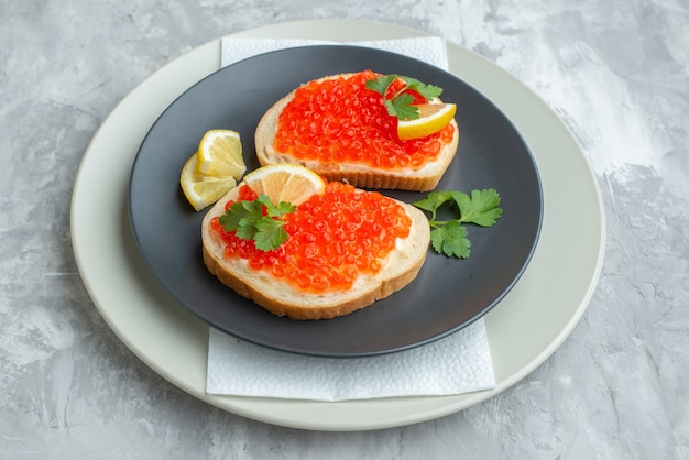 front view delicious caviar sandwiches inside plate on white surface snack bread dish breakfast meal dinner fish food toasts