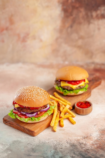 Front view delicious cheeseburger on cutting board light surface