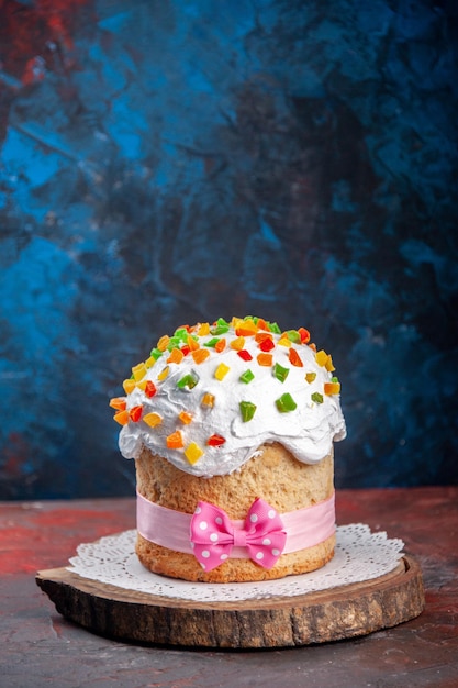 Front view delicious easter cake with white cream and dried fruits on dark background spring colourful dessert sweet pie bake ornate concept