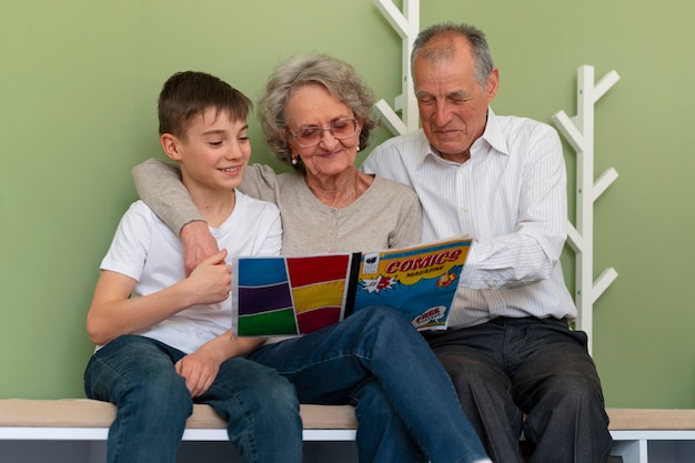 Front view family reading comics together