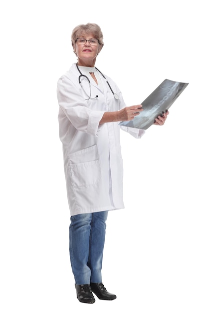 Front view of female doctor wearing stethoscope and glasses looking at an xray