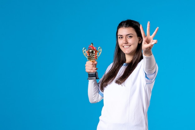 Front view female player with trophy