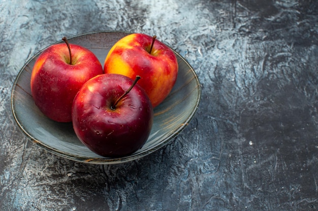 front view fresh red apples inside plate on dark background fruit ripe tree photo wood freshness juice colors