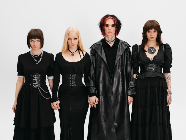 Front view goth friends posing in studio