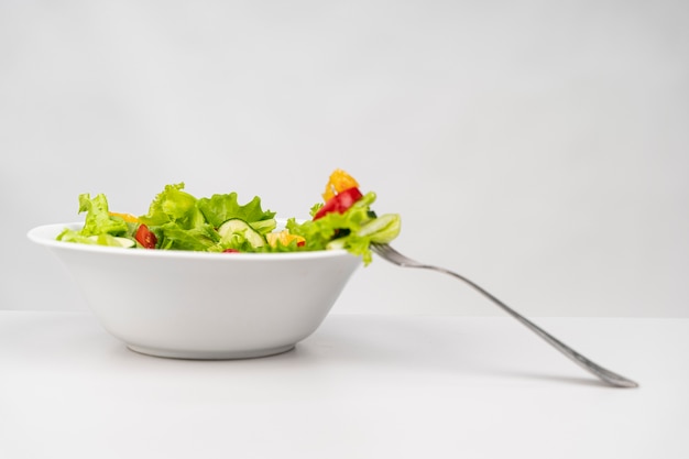 Front view healthy salad with fork