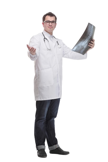 Front view of hospital doctor holding patients xray film