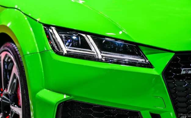 Front view of the LED headlights modern green car