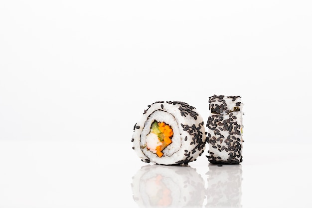 Front view maki sushi rolls with black sesame seeds