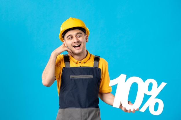 Front view of male worker in uniform with writing on blue 