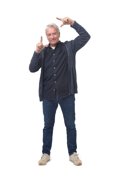 Front view of a man framing with his hands on white background